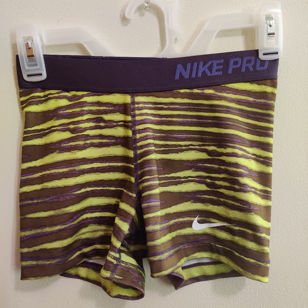 Green and purple Nike Pro shorts
